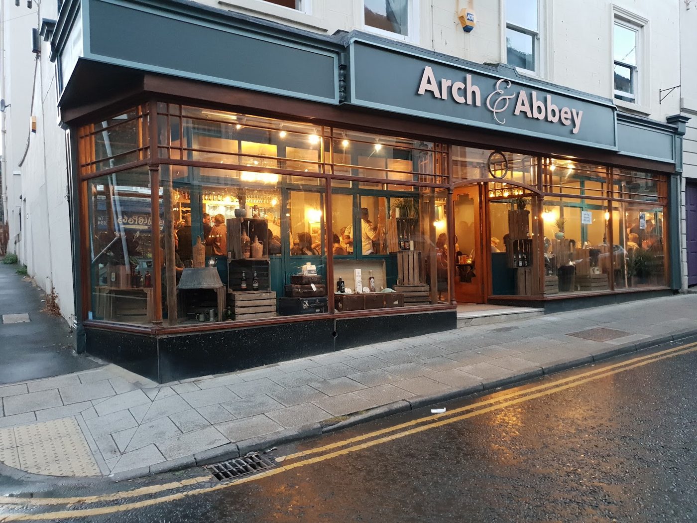 Arch & Abbey frontage lit up at night on Skinner Street